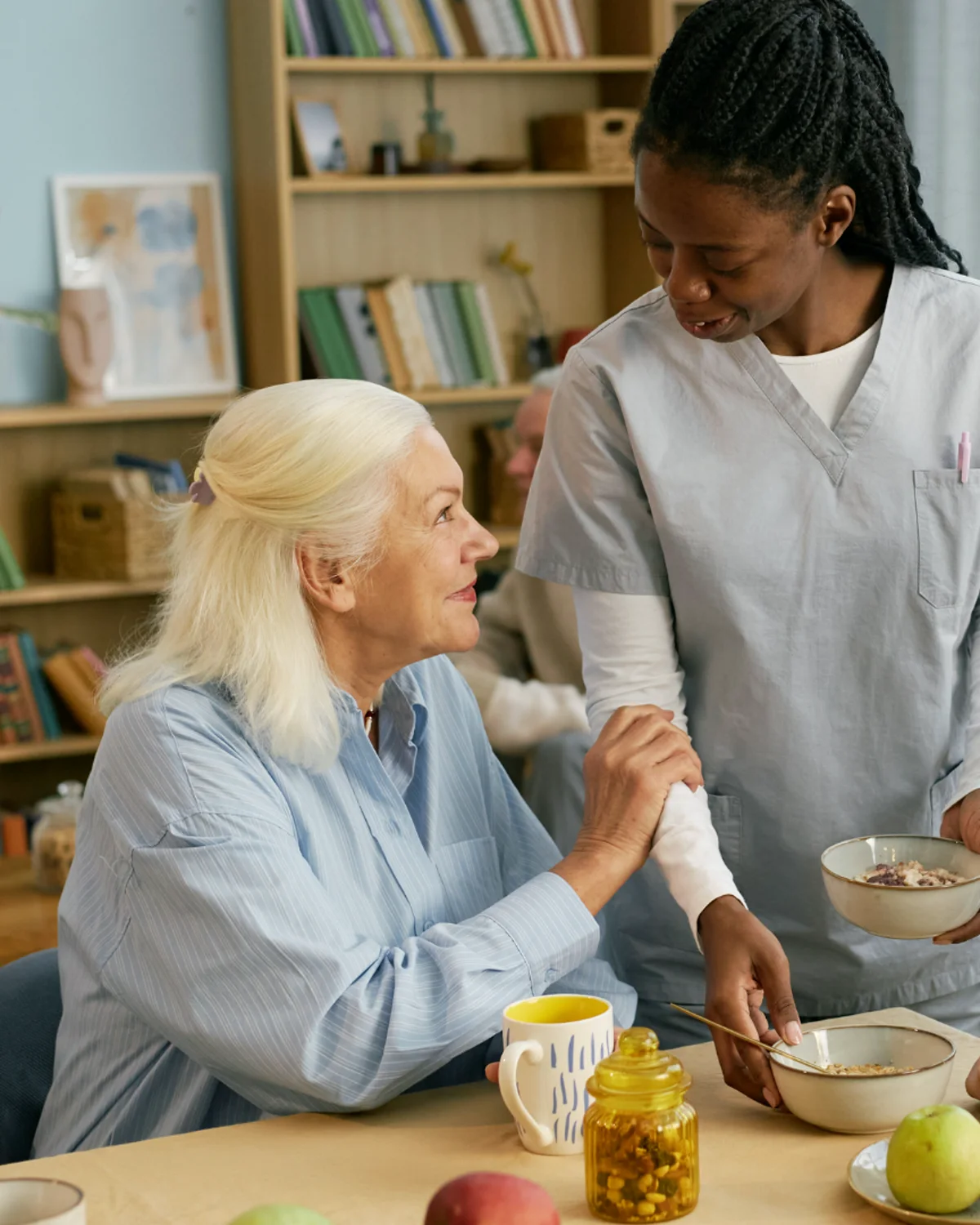 A companion sharing a reassuring conversation with an older adult
